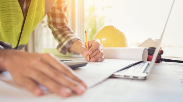 Construction engineer working Planning for a New Project on table in meeting room