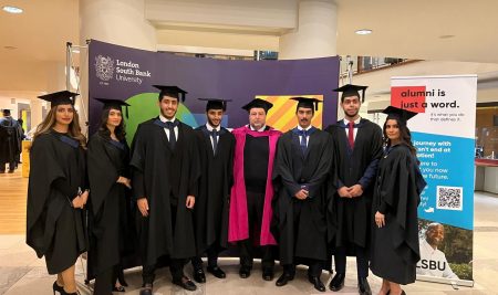 Graduates of the first cohort of British programs at Applied Science University attend their graduation ceremony at London South Bank University in the UK